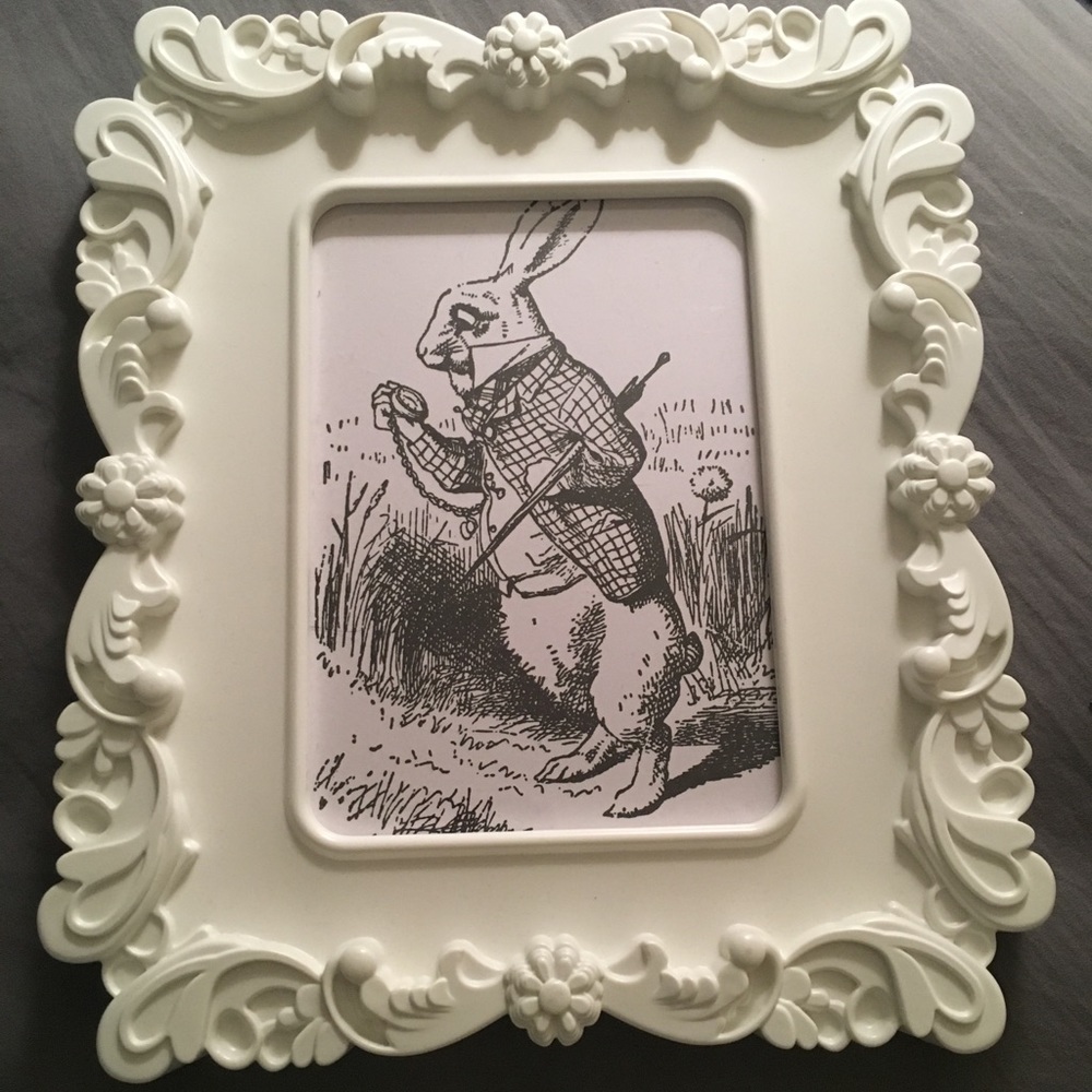 Frames with Alice in Wonderland photos.